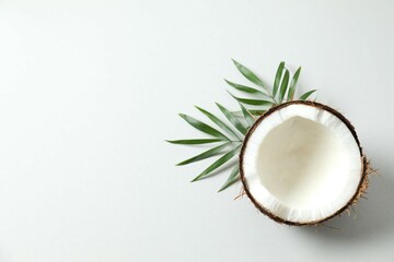 Coconut on gray background, top view