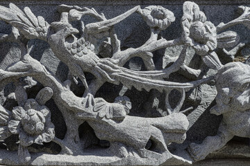 The relief on Elaborate sculptured of Stone carvings is a beautiful Taiwanese art style. Surface...