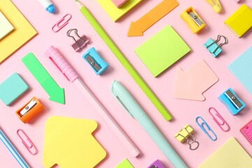 Flat lay with school stationery on wooden background, top view