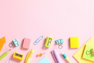 Flat lay with school stationery on wooden background, top view