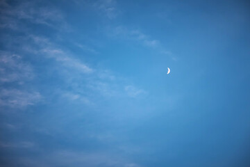 Half moon in the blue sky