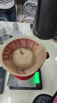 Close up the process of pouring water to drip coffee.