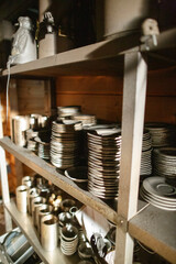 Damage assessment after a fire incident in a restaurant kitchen reveals soot and fire residue on kitchenware and equipment