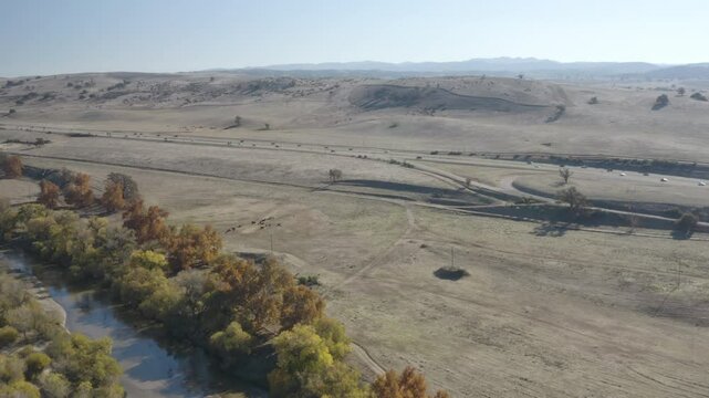 4K flight over the Salinas River and cow pasture along highway 101 outside Bradley California.