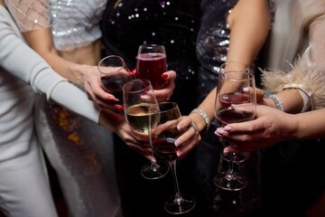 Cheers to a Fantastic Celebration Friends Joyfully Toasting with Wine Glasses in Hand
