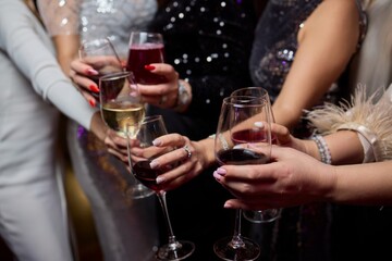 Cheers to a Fantastic Celebration Friends Joyfully Toasting with Wine Glasses in Hand