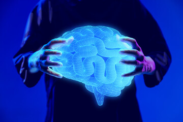 Hands holding glowing digital brain hologram, representing neuroscience research and medical...