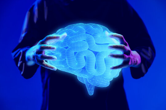 Hands holding glowing digital brain hologram, representing neuroscience research and medical innovation. Concept of medicine, futurism, advanced technologies, science, health care, neuroscience
