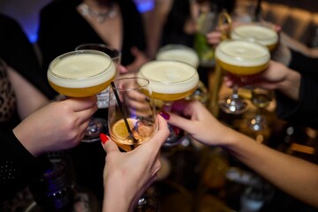 Cheers to a Fantastic Celebration Friends Joyfully Toasting with Wine Glasses in Hand