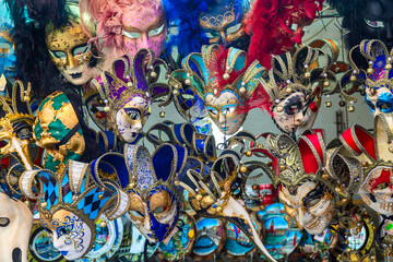Beautiful Venetian masks background. Street shop in Venice Italy outdoors. Tourism and travel...