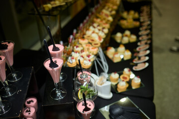 An Elegant Assortment of Gourmet Desserts and Savory Snacks Beautifully Arranged on Table