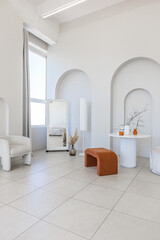 modern pure white interior design of a sprsious sitting room with soft stylish furniture. Large...