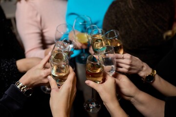 Cheers to a Fantastic Celebration Friends Joyfully Toasting with Wine Glasses in Hand