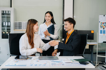 Asian business people working as a good team in the office. Successful teamwork in a meeting, workplace concept.