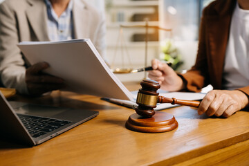 Teamwork of business lawyer meeting working hard about legal legislation in courtroom to help their customer