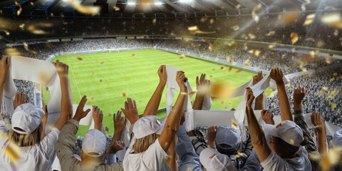 Back view of a packed stadium, cheering soccer fans enthusiastically supporting favorite team,...