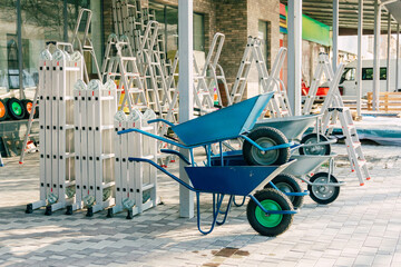 sale of construction equipment. stand for sale of ladders and trolleys for repair work