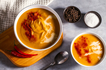 Pumpkin soup flat lay. Cream soup with paprika and chili pepper. Vegetable soup for vegan. Healthy eating. Concept of resaturant cafe healthy eating