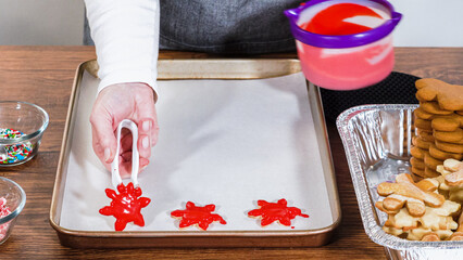Making Festive Gingerbread Sandwiches on Rustic Wooden Table