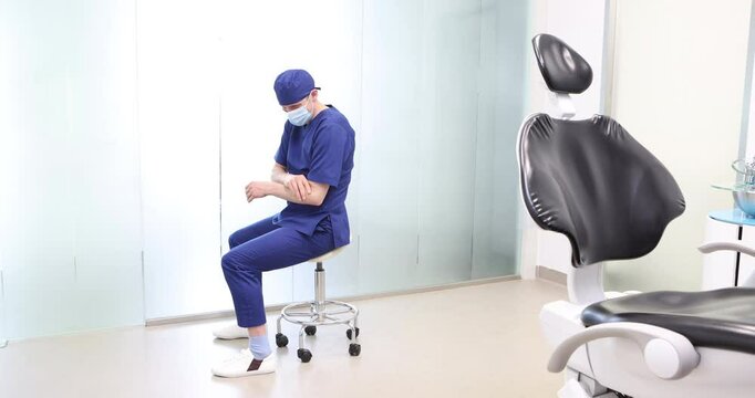 Sitting dentist, dealing with forearm muscle pain.Symptoms and self help exercises, stretching. profile view