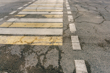 Obraz premium problem with roads in kazakhstan. crack in asphalt in shymkent. corruption in road construction