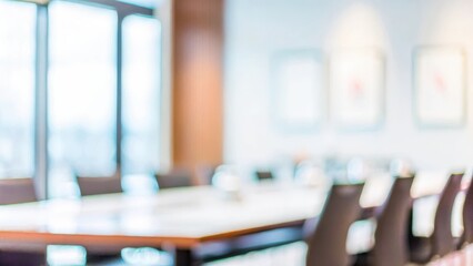 Conference Room Interior Blur – A blurry image of a conference room interior, featuring a long table and minimalist decor.	
