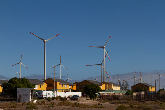 Wind turbines in the Canary Islands, located near Juan Grande and Castillo del Romeral, with residential homes affected by flickering effects from the turbines.