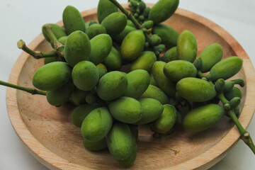 melinjo (Gnetum gnemon Linn).  open seed plants (Gymnosperms) on the wooden container