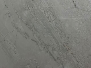 smooth gray marble texture with subtle veins and natural patterns, ideal for interior design, countertops, and modern aesthetic backdrops