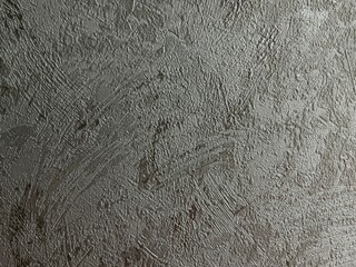 textured gray surface with abstract rough brush strokes and patterns, ideal for background, design elements, and industrial themes