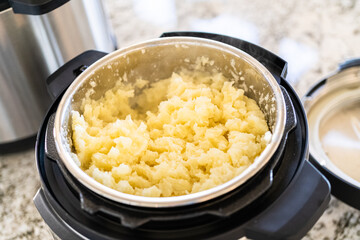 Whipping Up Creamy Mashed Potatoes in Modern Kitchen