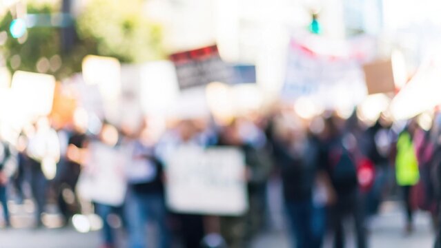 Government Reform Blur: A blurred background of a crowd protesting for political and government reform.	
