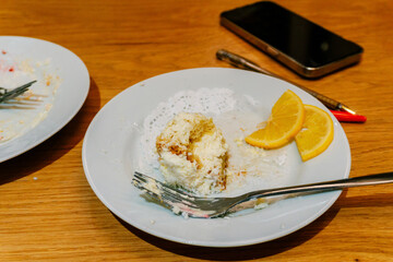 plates stained with cream after dessert. dirty plates in a coffee shop on the table