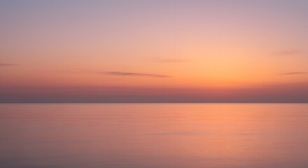 Fototapeta premium The Golden Veil of the Dawn Sky and Ocean in a Gentle Blur. 