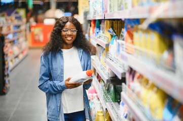 African American woman in a household chemical store