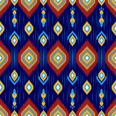 Vibrant geometric pattern featuring diamonds and stripes in blue, red, and yellow. Ideal for textiles, wallpapers, and decorative designs