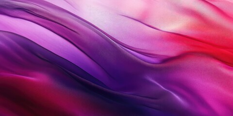 Fototapeta premium Abstract silky fabric draped in shades of purple and red, highlighting smooth texture and fluid lines, suitable for backgrounds or design projects.