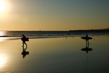 Silhouette of surfer catching afternoon waves