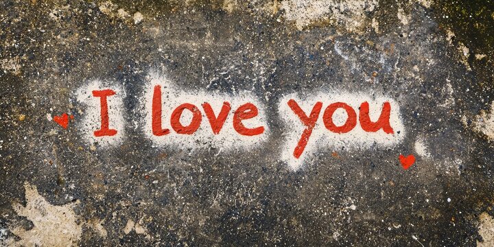 valentines day handwritten "I love you" message in sand