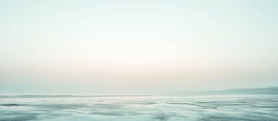 Obraz premium Serene soft pastel beach panorama with gentle waves and empty horizon showcasing tranquil blue and pink hues ideal for text overlay.