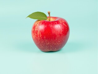 red apple on pastel teal background for food ads and branding visuals