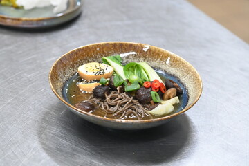 The Asian cuisine reflects a traditional Vietnamese dish, offering a harmonious blend of authentic flavors. Pho BO soup.