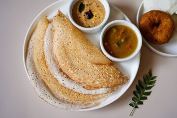 Homemade Triangle Dosa served with chutney sambar idli and vada | South Indian vegetarian breakfast