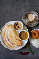 Homemade Triangle Dosa served with chutney sambar idli and vada | South Indian vegetarian breakfast