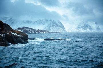 Dramatic Seascape with Snow-Capped Mountains