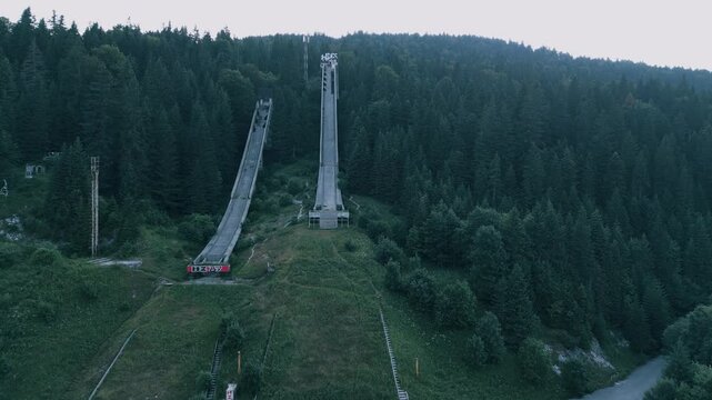Igman Ski Jump &ndash; Aerial View of Historic Olympic Venue - Stunning aerial footage of the Igman ski jump, a historic Olympic venue surrounded by breathtaking mountain scenery. The video showcases the ic
