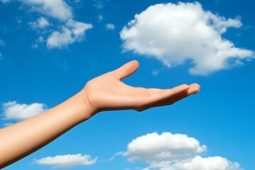 Open hand reaching for the clouds, symbolizing hope and aspiration