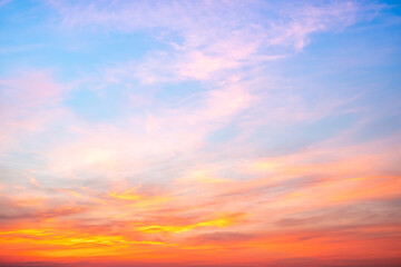 Obraz premium Sky,sunset, beautiful , luxury soft gradient orange gold clouds and sunlight on the blue sky perfect for the background, Sunrise on morning or everning in winter warm time ,Twilight summer,silhouette