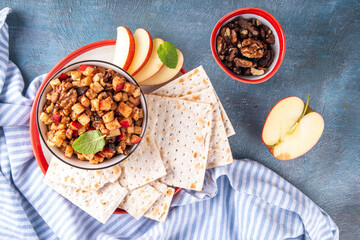 Traditional Charoset for Passover Seder and Pesah holiday, Jewish fruit salad haroset with diced apple, wine, cinnamon, nuts