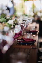 Elegant wine glass and water glass on a rustic table, perfect for fine dining and event settings